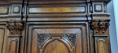 26770581c - Baroque cupboard/pilaster cupboard, probably Brunswick, around 1720, walnut veneer on oak body, carvings and profiles in solid oak, front with 3 pilasters and Corinthian capitals, cornice and base double cranked, doors and sides with cushion fillings, base with 2 drawers, orig. Locks, door with orig. Locomotive, original key and original Brass fittings, approx. 228 x 208 x 78 cm, condition 2