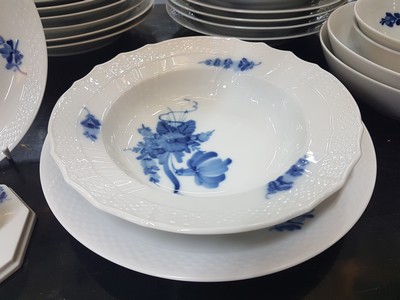 26773884f - Dining service, Kgl. Copenhagen, porcelain, basket-like relief rim, blue flower painting under the glaze, 16 flat plates, 17 deep plates, 4 soup bowls with saucers, 2 round side dishes, 2 round bowls, gravy boat, mustard pot, rectangular bowl, 2 candlesticks, traces of usage