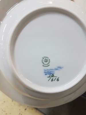 26773884h - Dining service, Kgl. Copenhagen, porcelain, basket-like relief rim, blue flower painting under the glaze, 16 flat plates, 17 deep plates, 4 soup bowls with saucers, 2 round side dishes, 2 round bowls, gravy boat, mustard pot, rectangular bowl, 2 candlesticks, traces of usage