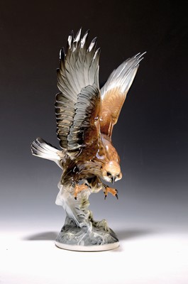 Image 26773891 - Porcelain figurine golden eagle, Hutschenreuther, Selb, designed by Karl Tutter, 1950/60s, porcelain, polychrome realistically painted, eagle swooping, round base, 1 claw restored, signed K.Tutter on the base, height 44 cm