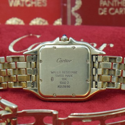 26773894d - CARTIER Panthere wristwatch in 18k yellow gold, Switzerland sold according to papers in June 1995, quartz, two-piece construction case, back with 8 screws, original bracelet with butterfly buckle, silvered dial with Roman numerals, blued steel hands, date, measures approx. 38 x 29 mm, length approx. 18 cm, papers and service-box enclosed, condition 2-3