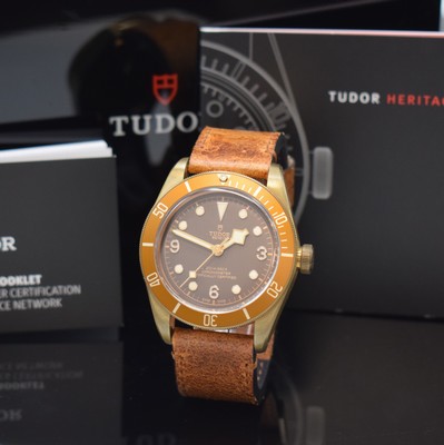 Image 26774221 - TUDOR Armbandchronometer Black Bay bronze reference 79250B, self winding, case back and winding crown screwed down, waterproof from manufacturing, original leather strap with buckle, unidirectional revolving bezel, brown dial with luminous-indices, luminous hands, display of hour, minutes and sweep seconds, diameter approx. 43 mm, original box, description and additional textile strap enclosed, condition 2