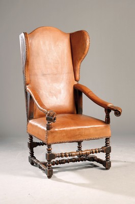 Image 26774590 - Wing back chair/baroque chair, around 1750, solid walnut, leather covered, edges decoratedwith leather stitching, approx. 138 x 72 x 84 cm Sh. approx. 47 cm, condition 2