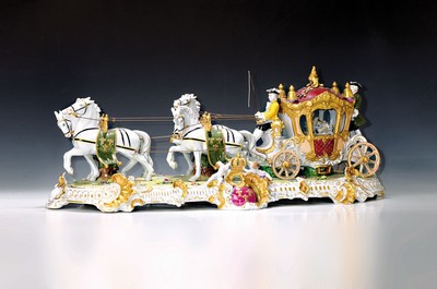 Image 26776716 - Large four-horse rococo carriage, Unterweißbach, Thuringia, 20th century, designed by Kurt Steiner (1904-1970), porcelain, polychrome painted, rich gold decoration, coachman, pillion passenger and noble lady with tulle lace dress inside, base with shellwork decoration, floor mark, 31x80x33 cm, traces of age