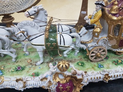 26776716a - Large four-horse rococo carriage, Unterweißbach, Thuringia, 20th century, designed by Kurt Steiner (1904-1970), porcelain, polychrome painted, rich gold decoration, coachman, pillion passenger and noble lady with tulle lace dress inside, base with shellwork decoration, floor mark, 31x80x33 cm, traces of age