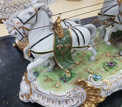 26776716g - Large four-horse rococo carriage, Unterweißbach, Thuringia, 20th century, designed by Kurt Steiner (1904-1970), porcelain, polychrome painted, rich gold decoration, coachman, pillion passenger and noble lady with tulle lace dress inside, base with shellwork decoration, floor mark, 31x80x33 cm, traces of age