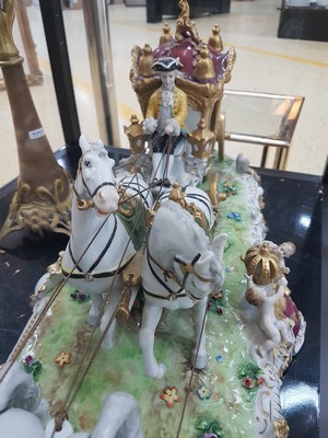26776716i - Large four-horse rococo carriage, Unterweißbach, Thuringia, 20th century, designed by Kurt Steiner (1904-1970), porcelain, polychrome painted, rich gold decoration, coachman, pillion passenger and noble lady with tulle lace dress inside, base with shellwork decoration, floor mark, 31x80x33 cm, traces of age