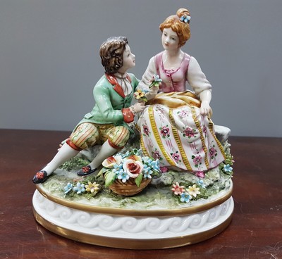 26777472g - Two porcelain figurines, Capodimonte, Italy, 20th century, Fullin Mollica, porcelain, polychrome painted, gold decoration, gallant group of figures and nobleman with grapes (slightly damaged), H. 13/15 cm