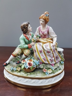 26777472h - Two porcelain figurines, Capodimonte, Italy, 20th century, Fullin Mollica, porcelain, polychrome painted, gold decoration, gallant group of figures and nobleman with grapes (slightly damaged), H. 13/15 cm