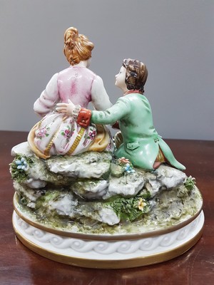 26777472j - Two porcelain figurines, Capodimonte, Italy, 20th century, Fullin Mollica, porcelain, polychrome painted, gold decoration, gallant group of figures and nobleman with grapes (slightly damaged), H. 13/15 cm