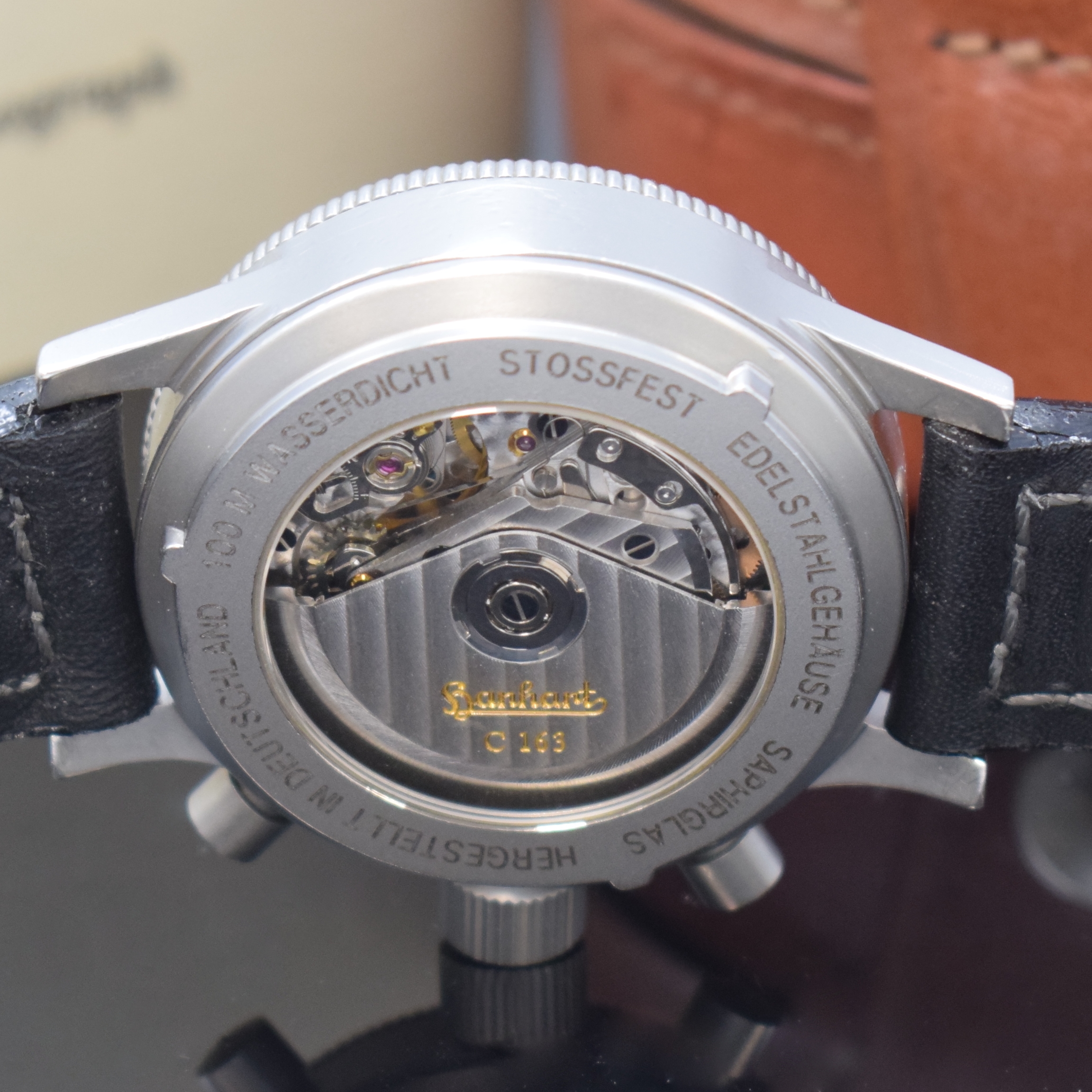 Detail e: HANHART Armbandchronograph Modell Sirius Referenz 710, Automatik, Deutschland um 2001, Edelstahlgeh. inkl. orig. Lederband m. orig. Dornschl., zus. 2 ...