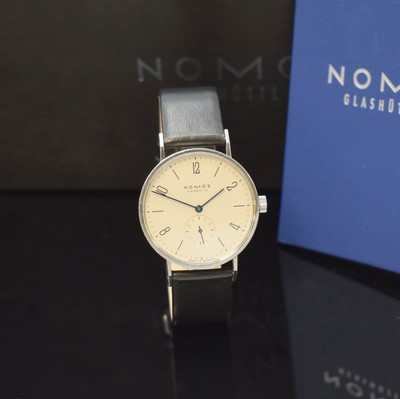 Image 26777748 - NOMOS Glashütte Tangente to 125 pieces limited gents wristwatch in steel, Germany sold according to papers in May 2003, manual winding, snap on case back and bezel, silvered dial with Arabic numerals and line-indices, blued steel hands, calibre ETA 7001, 17 jewels, blued screws, diameter approx. 35 mm, original box and papers, signs of use otherwise condition 2