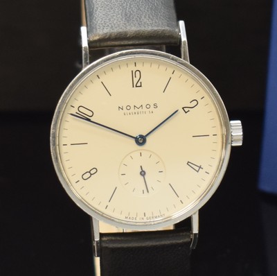 26777748a - NOMOS Glashütte Tangente to 125 pieces limited gents wristwatch in steel, Germany sold according to papers in May 2003, manual winding, snap on case back and bezel, silvered dial with Arabic numerals and line-indices, blued steel hands, calibre ETA 7001, 17 jewels, blued screws, diameter approx. 35 mm, original box and papers, signs of use otherwise condition 2