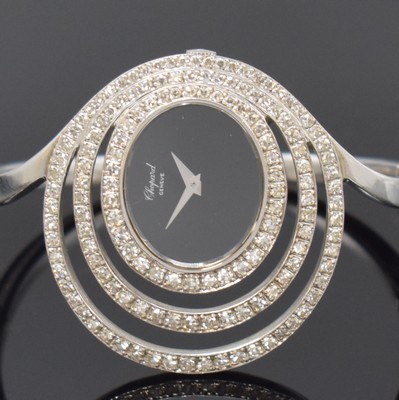 26777850a - CHOPARD unusual and rare 18k white gold and diamonds set ladies wristwatch, Switzerland around 1980, manual winding, oval case, snap on case back, clasp, onyx-dial with silvered hands, measures approx. 41 x 34 mm, for arm circumference approx. 5 x 4,5 cm, overhaul recommended at buyer's expense, condition 2