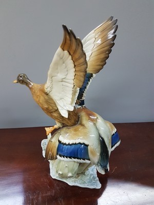 26777911c - Porcelain figure group, Hutschenreuther, duck. Hans Achtziger, 1960s, porcelain, naturalistic painting, pair of flying ducks, traces of age, bottom mark, height 37.5 cm