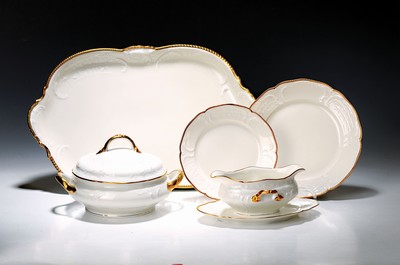 Image 26777912 - Dinner service, Rosenthal, Sanssouci, 20th century, porcelain, gold rim, flag with shell work in relief, 12 dinner plates D. 25cm, 12 soup plates D. 24cm, 12 bread plates D. 20.5cm, 2 lidded tureens, 2 rectangular bowls, gravy boat, 3 different sized plates, traces of age, partly slightly rubbed