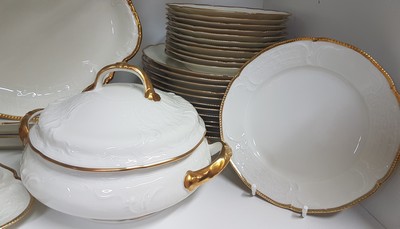 26777912a - Dinner service, Rosenthal, Sanssouci, 20th century, porcelain, gold rim, flag with shell work in relief, 12 dinner plates D. 25cm, 12 soup plates D. 24cm, 12 bread plates D. 20.5cm, 2 lidded tureens, 2 rectangular bowls, gravy boat, 3 different sized plates, traces of age, partly slightly rubbed