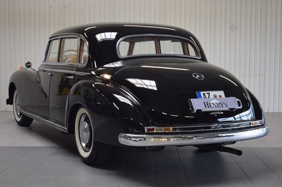 26778255c - Mercedes-Benz 300 Adenauer, first registered 08/1952, mileage read 23,000 km, 3 owners, historic registration, MOT 10/2025, 85 kW/115 PS, 6-cylinder, manual transmission, black exterior, Beige/Grey leather interior, original set of luggage available. The vehicle was first registered in Kaiserslautern (copy of registration document available). There are various invoices for the vehicle from 2012 to 01/2023 totaling costs of 71,438.00.-. A folder with invoices and an expert report is available