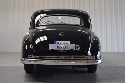 26778255d - Mercedes-Benz 300 Adenauer, first registered 08/1952, mileage read 23,000 km, 3 owners, historic registration, MOT 10/2025, 85 kW/115 PS, 6-cylinder, manual transmission, black exterior, Beige/Grey leather interior, original set of luggage available. The vehicle was first registered in Kaiserslautern (copy of registration document available). There are various invoices for the vehicle from 2012 to 01/2023 totaling costs of 71,438.00.-. A folder with invoices and an expert report is available