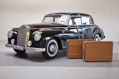 26778255j - Mercedes-Benz 300 Adenauer, first registered 08/1952, mileage read 23,000 km, 3 owners, historic registration, MOT 10/2025, 85 kW/115 PS, 6-cylinder, manual transmission, black exterior, Beige/Grey leather interior, original set of luggage available. The vehicle was first registered in Kaiserslautern (copy of registration document available). There are various invoices for the vehicle from 2012 to 01/2023 totaling costs of 71,438.00.-. A folder with invoices and an expert report is available