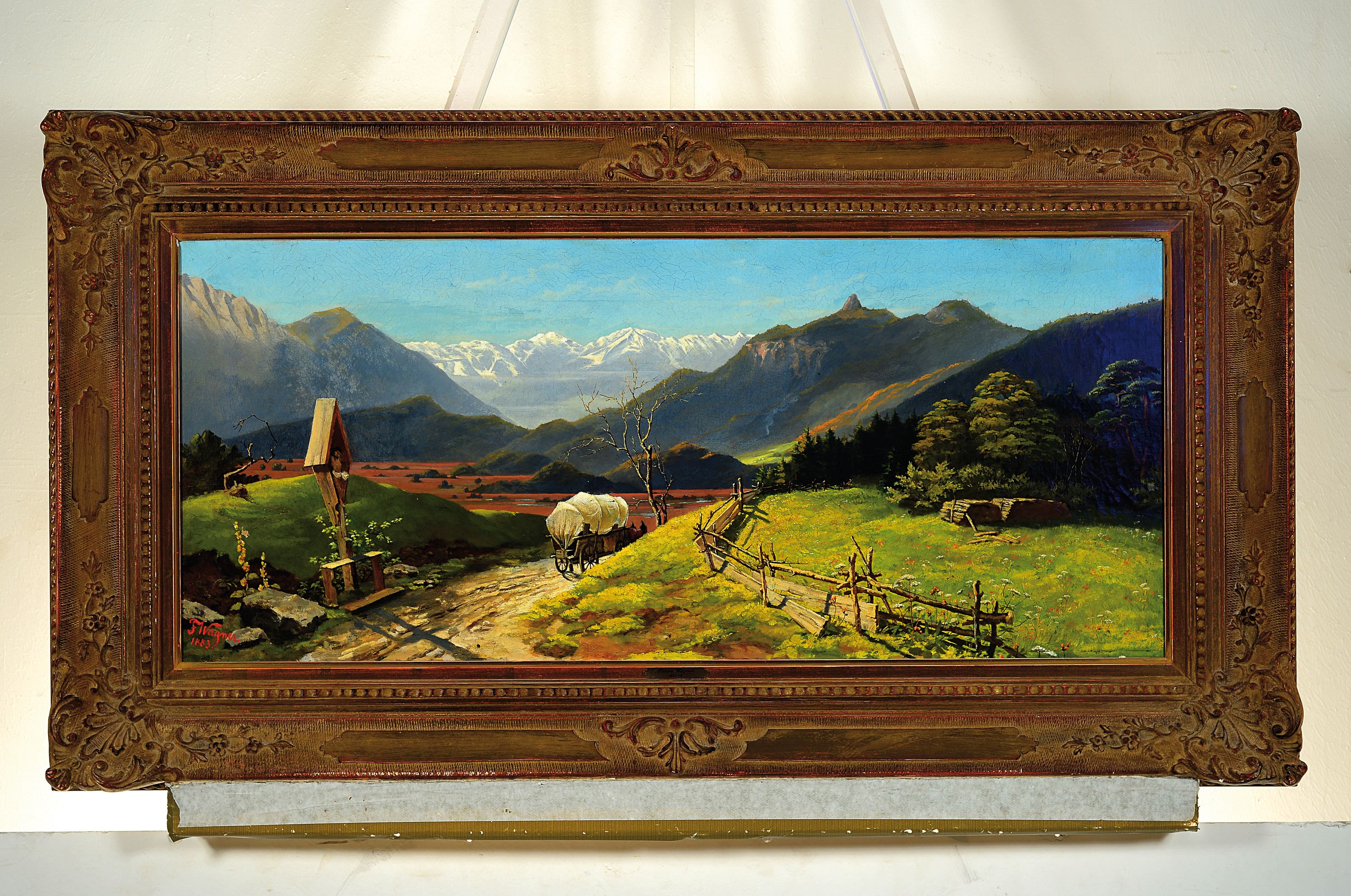 Detail k: F. Wagner, datiert 1883, Münchener Schule, Voralpenlandschaft, Blick in ein Tal mit Flurkreuz und Zeltwagen,l. rest., links unten signiert, Öl/Lwd, ...