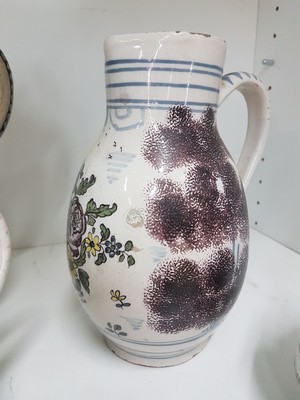 26778677b - Seven jugs, German, 18th century, mostly faience, roller jugs with tin lids, painted, one jug slightly Chipped, a jug with a crack, two pear jugs, decor nobleman with bottle, height approx. 15.5 cm, jug with tin lid and toast, height 16 cm, small pear shaped jug with pewter lid, height 16 cm, pear shaped jug with bouquet of flowers, height 22 cm, l. best.; Stoneware jug , vegetal incised decoration, pewter lid, height 29 cm, all parts with slight Age damage or signs of age