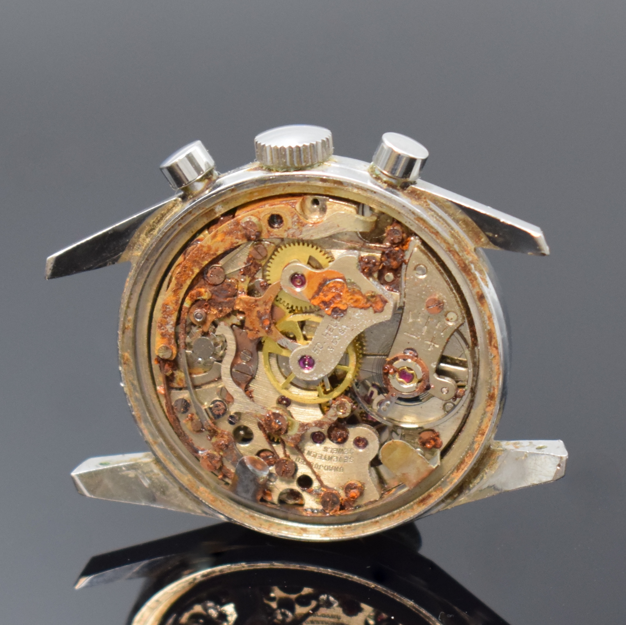 Detail c: HEUER LEONIDAS S.A. Carrera Schaltradchronograph, Schweiz um 1965, Handaufzug, Edelstahlgeh., Boden geschr., orig. Krone, silb. Zifferbl. m. aufges. ...