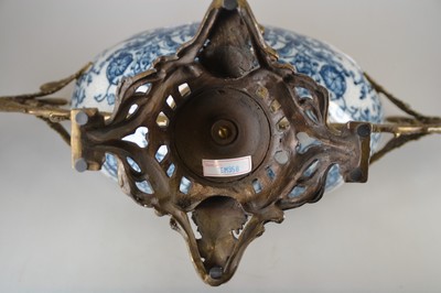 26778700f - Offering bowl, German, end of the 19th century, navette-shaped faience bowl, underglaze blue floral decoration inside and outside, bronze fittings in the Renaissance style, base with masquerades, double handle formed from a pair of swans, 30x44x18 cm, unidentified bottom mark, traces of age