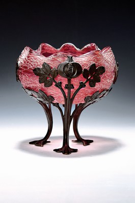 Image 26779572 - Offering bowl, Austria, around 1900, pink glass body with applied net, metal fittings in a stylized chestnut shape, height approx. 20cm, diameter approx. 22cm