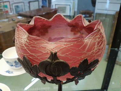 26779572b - Offering bowl, Austria, around 1900, pink glass body with applied net, metal fittings in a stylized chestnut shape, height approx. 20cm, diameter approx. 22cm