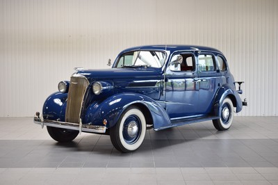 26779699b - Chevrolet Master Deluxe, first registered 01/1937, chassis number: 21GB0212426, mileage approximately 80.500 km read, MOT until 10/2023, 63 kW/85 PS, manual transmission, exterior color blue, interior fabric-red. The vehicle has undergone a complete rebuild, including sandblasting the frame, reupholstering seats, and entirely rebuilding the interior