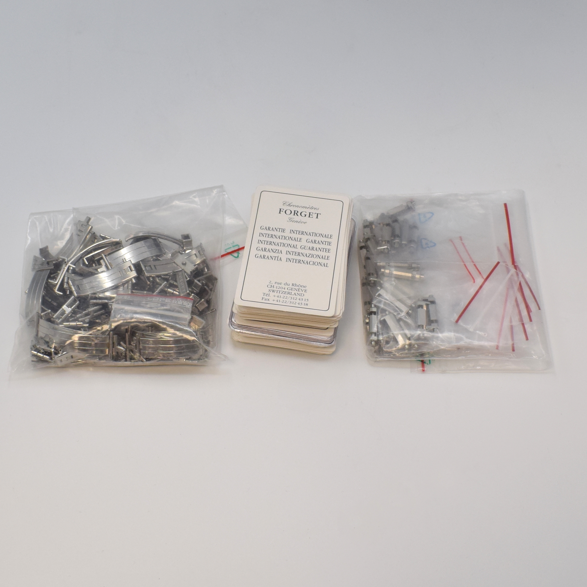 Detail i: Konvolut Forget 4 Armbanduhren und großes Lot an Forget Ersatzteilen, Schweiz 1990er Jahre, Uhren alle Automatik und beids. vergl. an orig. ...