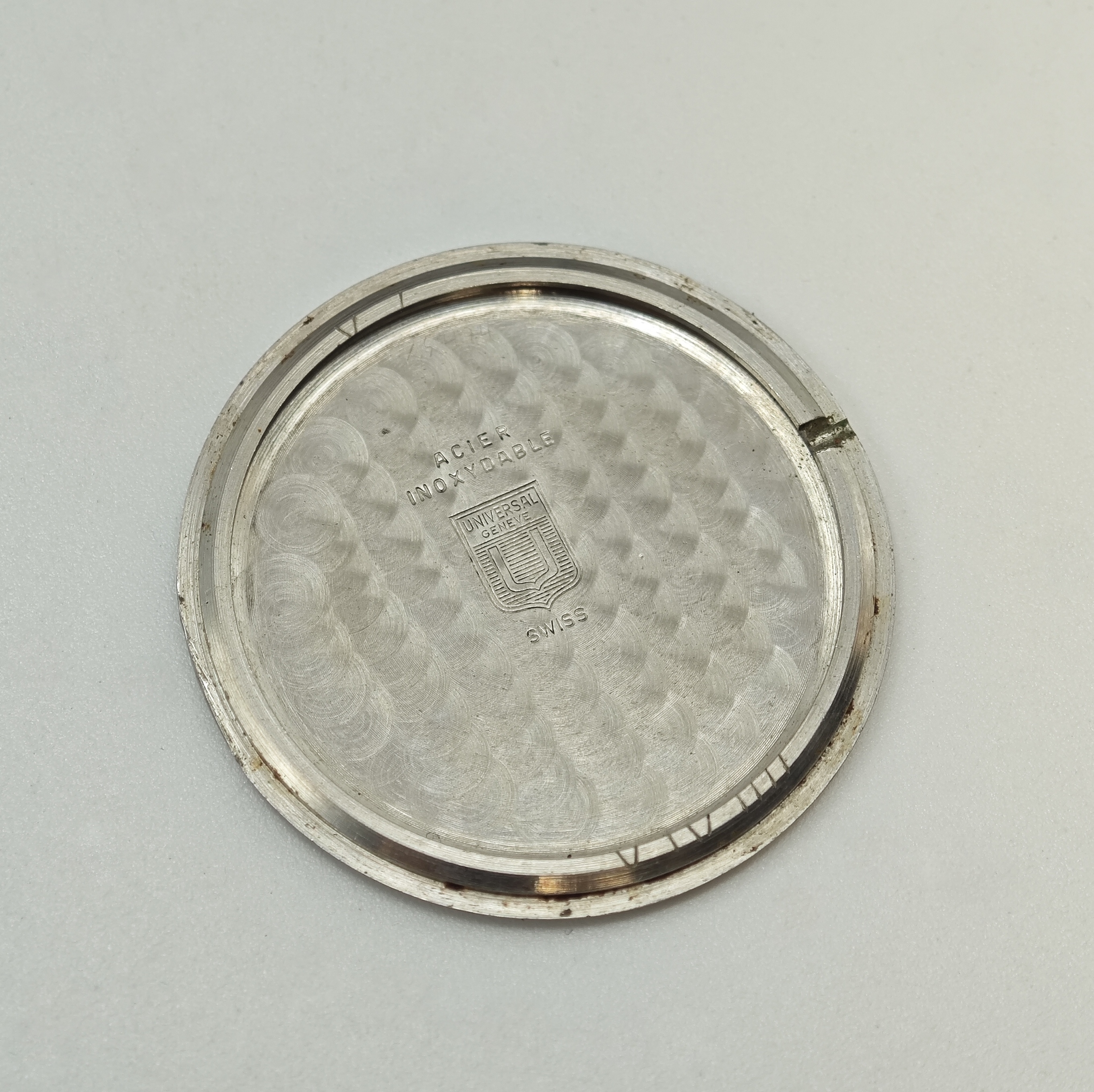 Detail d: UNIVERSAL White Shadow flache Automatik- Armbanduhr Referenz 866101/05 in Stahl, Schweiz um 1968, 2-tlg. Geh., Boden aufgedr., orig. Krone, blau ...