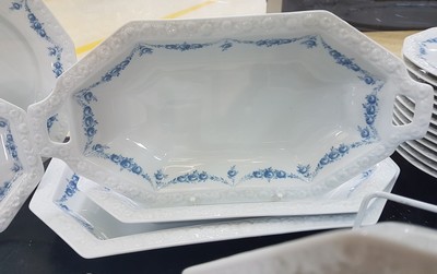 26779970f - Dinner service, Rosenthal classic rose, model Maria with blue flower tendrils, 13 flat plates 27.5cm; 13 deep plates 24cm; 8 cake plates; 9 compote bowls; 7 side bowls D. 4 of approx. 21 cm, 2 of approx. 23.5 cm, approx. 27cm; 2 oval plates, 39x23.5 cm, 33.5x20 cm.; Bread basket/handle bowl 37x18.5 cm, king cake plate, 2 different gravy boats, salt and pepper shakers