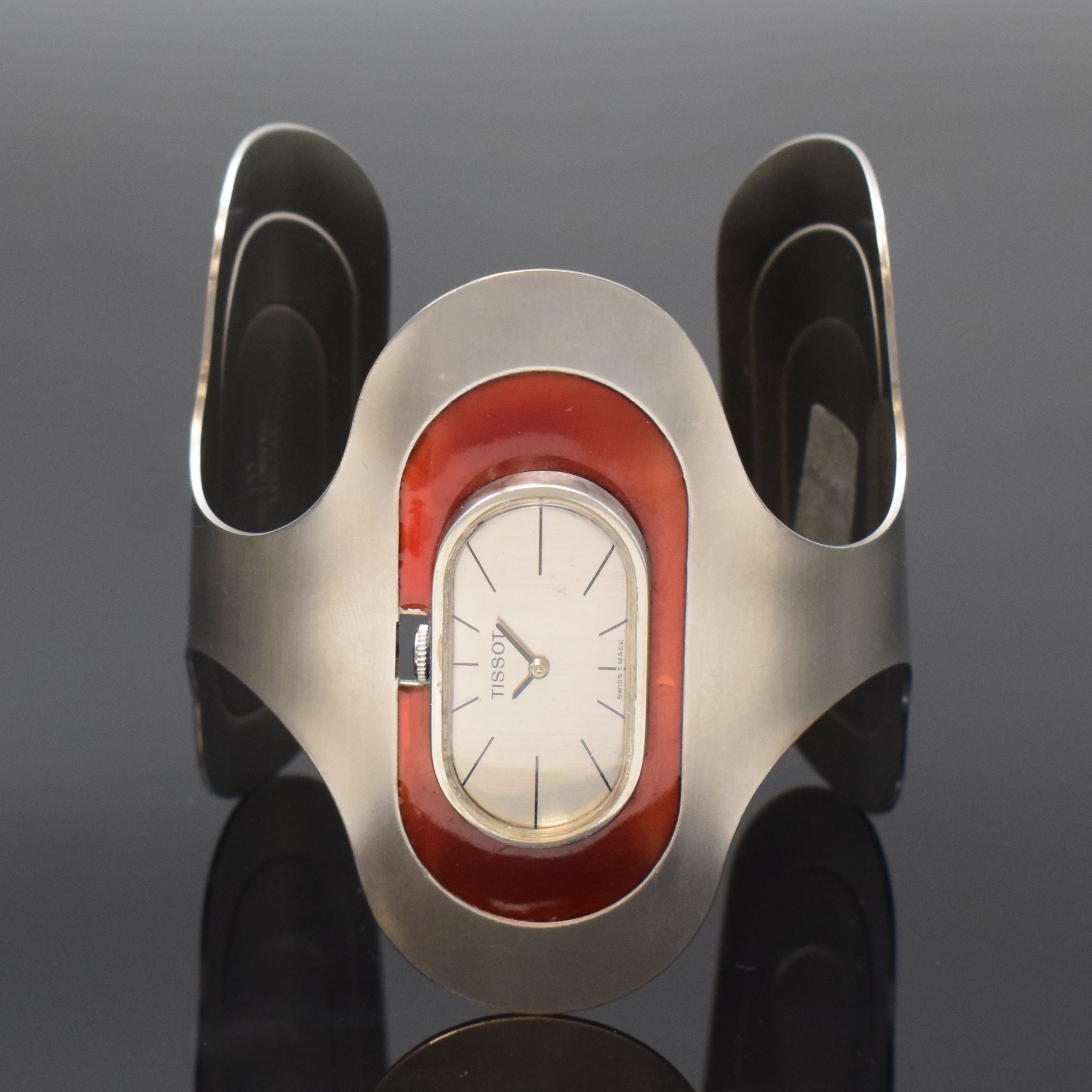 TISSOT sehr seltene Design-Damenuhr in Edelstahl, Schweiz um 1975, Handaufzug, Spangen-Gehäuse m. roten Lack-Einlagen, ovales silb. Zifferbl., ...