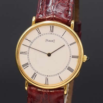 26780055a - PIAGET 18k yellow gold reference 9035 thin and elegant wristwatch, Switzerland around 1970, manual winding, two piece construction case, snap on case back, white dial patinated, fine Roman numerals, line hands, silvered movement calibre 9P2 with fausses cotes decoration, 18 jewels, 5 adjustments, diameter approx. 32,5 mm, needs to be overhauled, condition 2-3, property of a collector