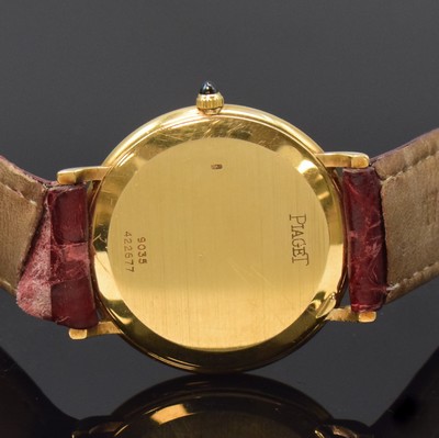 26780055c - PIAGET 18k yellow gold reference 9035 thin and elegant wristwatch, Switzerland around 1970, manual winding, two piece construction case, snap on case back, white dial patinated, fine Roman numerals, line hands, silvered movement calibre 9P2 with fausses cotes decoration, 18 jewels, 5 adjustments, diameter approx. 32,5 mm, needs to be overhauled, condition 2-3, property of a collector