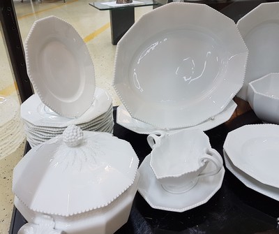 26780069a - Dinner service, Nymphenburg, 20th century, 12 -sided basic shape with raised pearl rim, 12 flat plates, 11 deep plates, lidded tureen, 3 side dishes, 2 oval plates, 2 oval bowls, large round plate, gravy boat, slight traces of usage