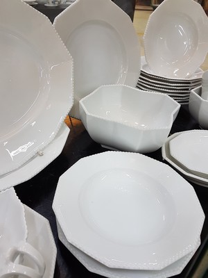 26780069b - Dinner service, Nymphenburg, 20th century, 12 -sided basic shape with raised pearl rim, 12 flat plates, 11 deep plates, lidded tureen, 3 side dishes, 2 oval plates, 2 oval bowls, large round plate, gravy boat, slight traces of usage