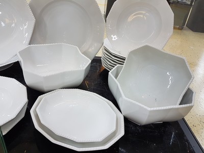 26780069c - Dinner service, Nymphenburg, 20th century, 12 -sided basic shape with raised pearl rim, 12 flat plates, 11 deep plates, lidded tureen, 3 side dishes, 2 oval plates, 2 oval bowls, large round plate, gravy boat, slight traces of usage