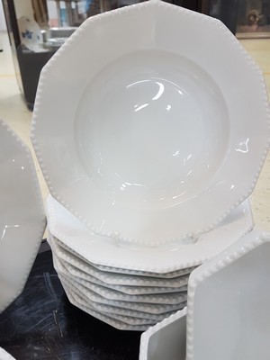 26780069d - Dinner service, Nymphenburg, 20th century, 12 -sided basic shape with raised pearl rim, 12 flat plates, 11 deep plates, lidded tureen, 3 side dishes, 2 oval plates, 2 oval bowls, large round plate, gravy boat, slight traces of usage