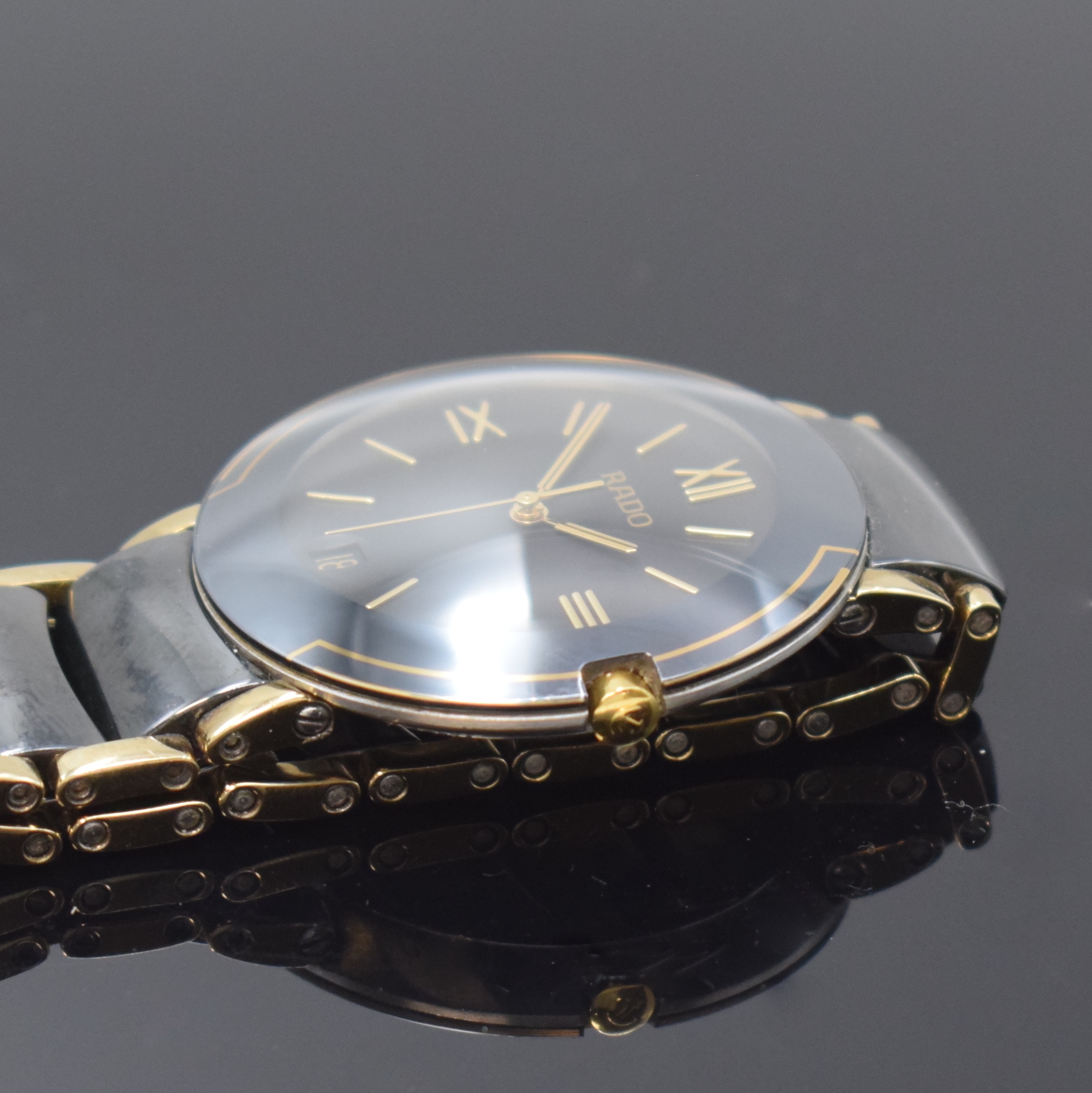 Detail b: RADO Diastar Herrenarmbanduhr Referenz 115.0622.3, Schweiz um 2006, quarz, Edelstahlgeh., Boden aufgedr., Keramik- Gliederband m. dopp. Faltschl. in ...
