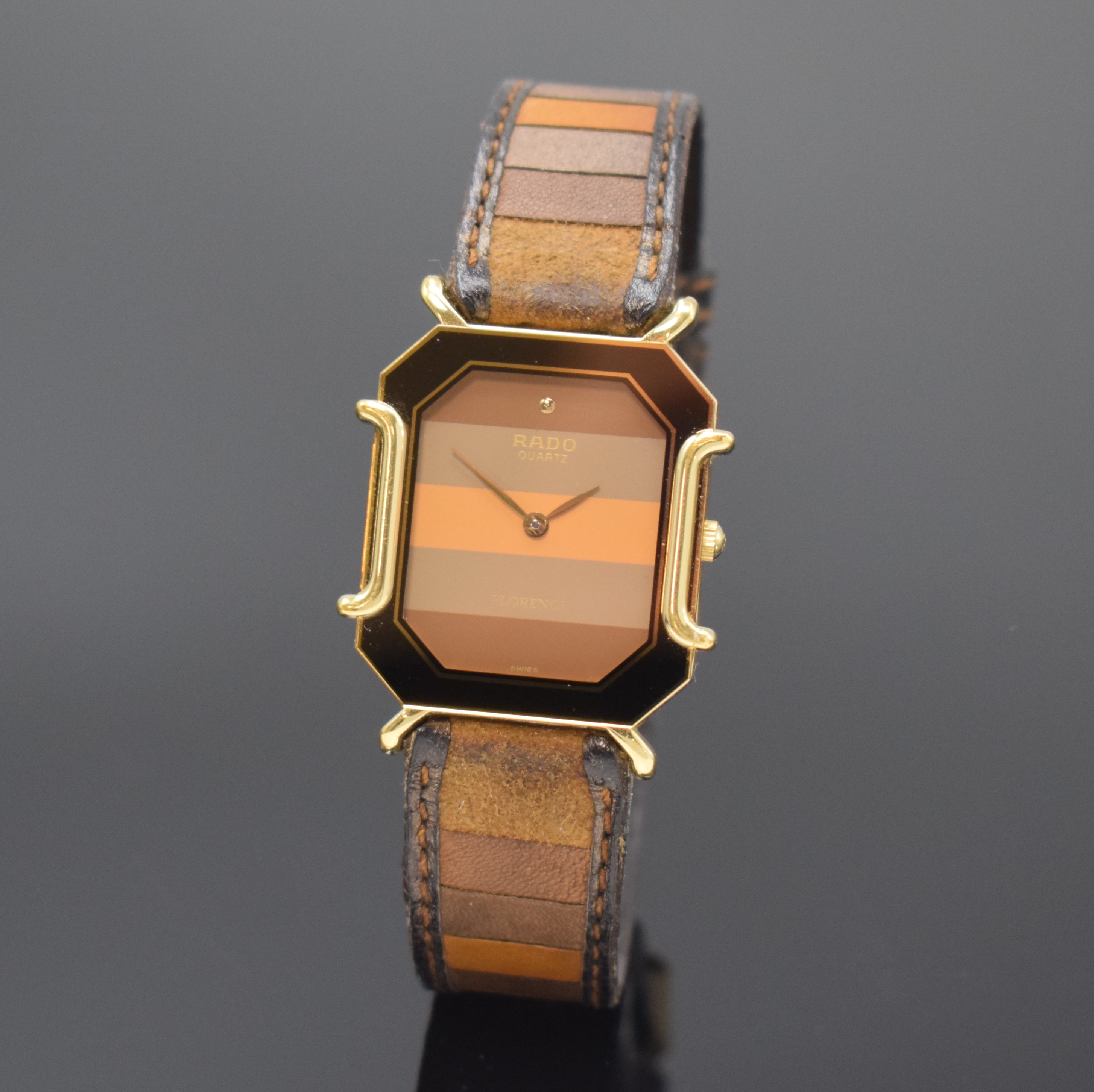 RADO Florence Armbanduhr Referenz 150.3408.2, Schweiz um 1995, quarz, Stahl/vergoldet, Boden 4-fach verschr., orig. Lederband m. Dornschl., mehrfarb. ...