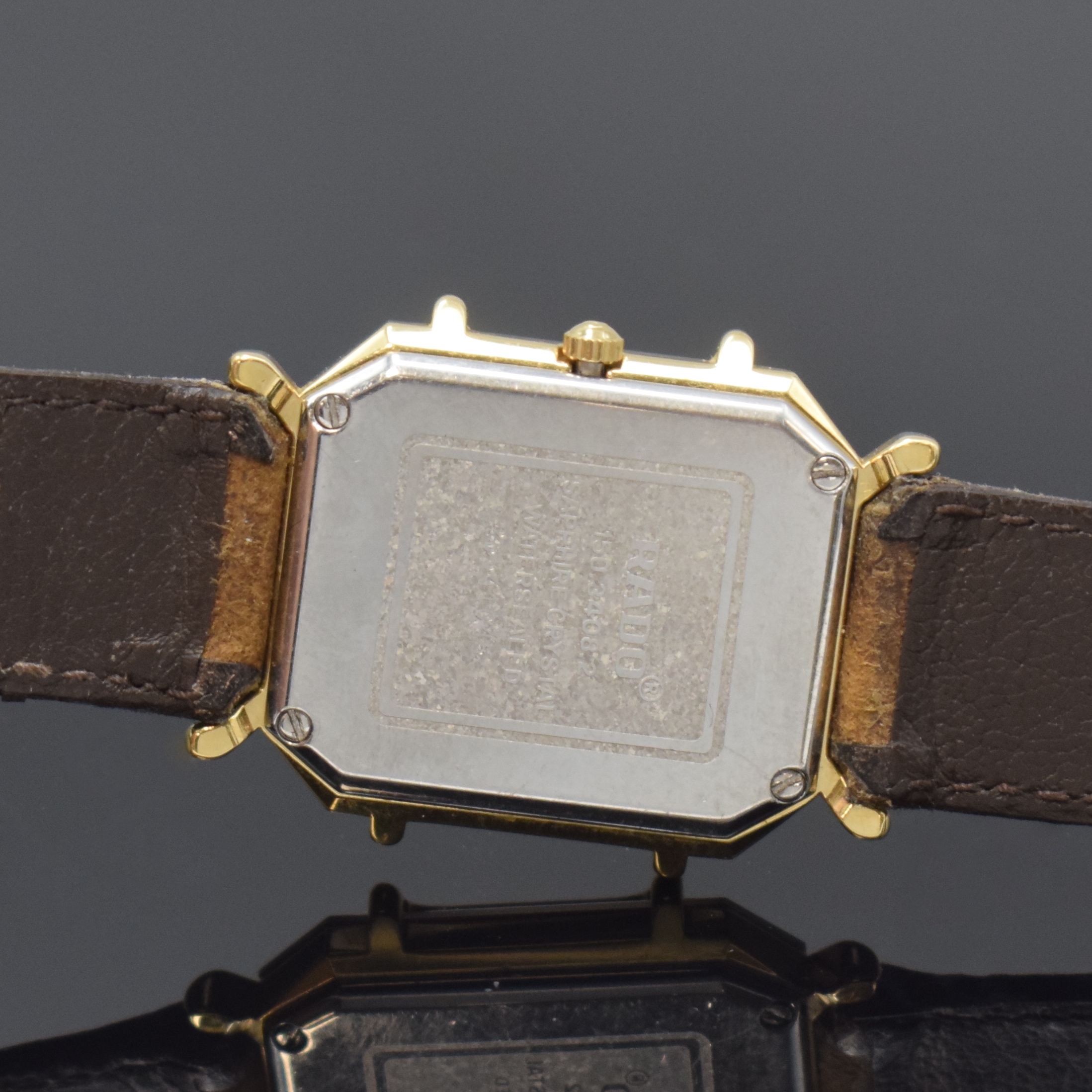 Detail d: RADO Florence Armbanduhr Referenz 150.3408.2, Schweiz um 1995, quarz, Stahl/vergoldet, Boden 4-fach verschr., orig. Lederband m. Dornschl., mehrfarb. ...
