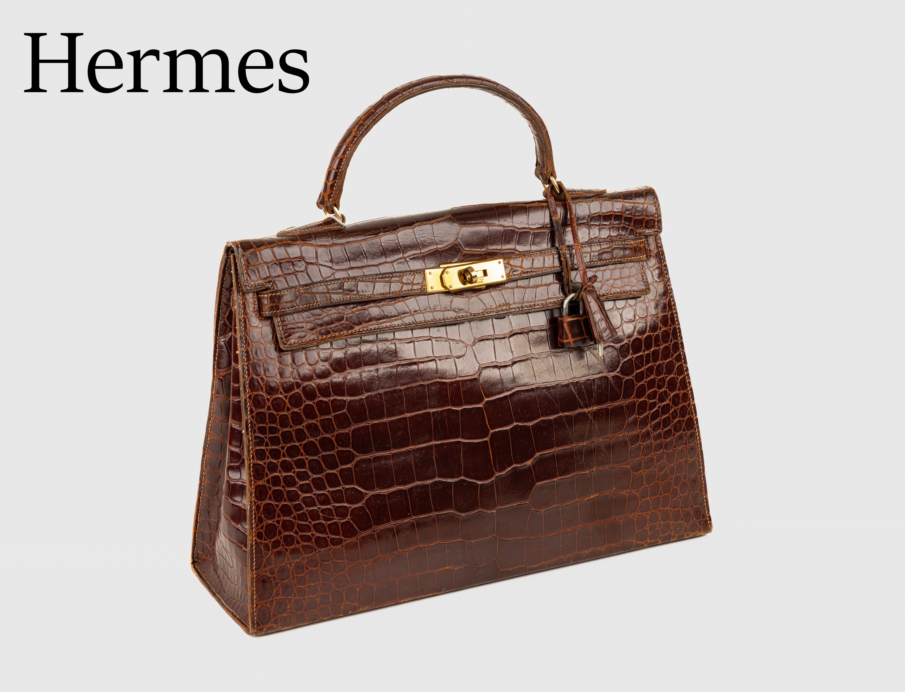 Vintage HERMES Kelly Bag, 1960, Shiny Porosus Crocodile in Havanna Braun, Innenaustattung auf feinem Ziegenleder, goldene Hardware, ca. 32 x 11.5 x ...