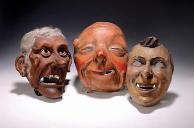 Image 26781752 - Three masks, Swiss/Alemannic, 19th and 20th centuries, carved wood, a. distorted face with wart, approx. 28 x 19 cm, crack; b. Mask with movable jaw and hair, approx. 25 x 24 cm; c. Mask, young man, height approx. 25 cm