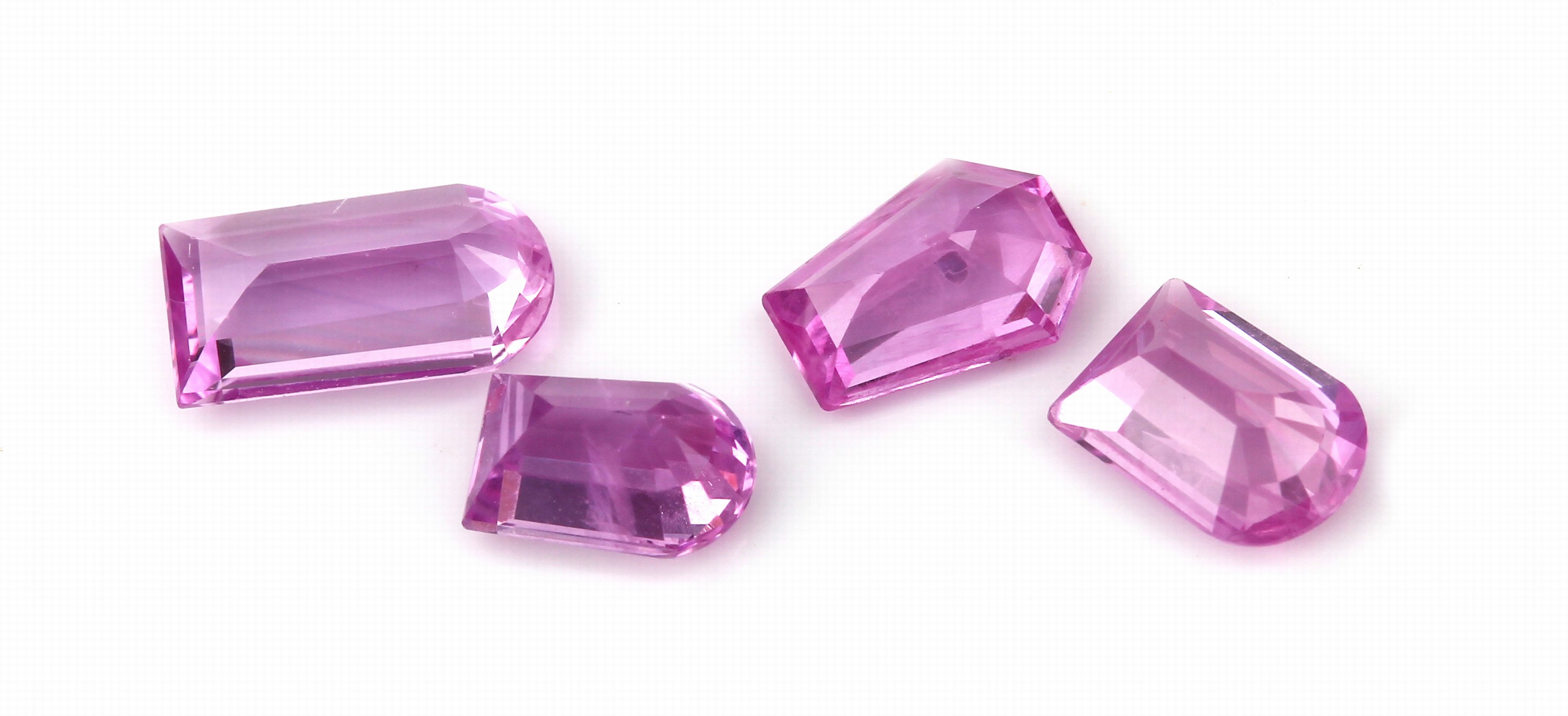Detail a: Lot 4 pinkfarb. Saphire im Phantasieschliff, zus. ca. 2.99 ct