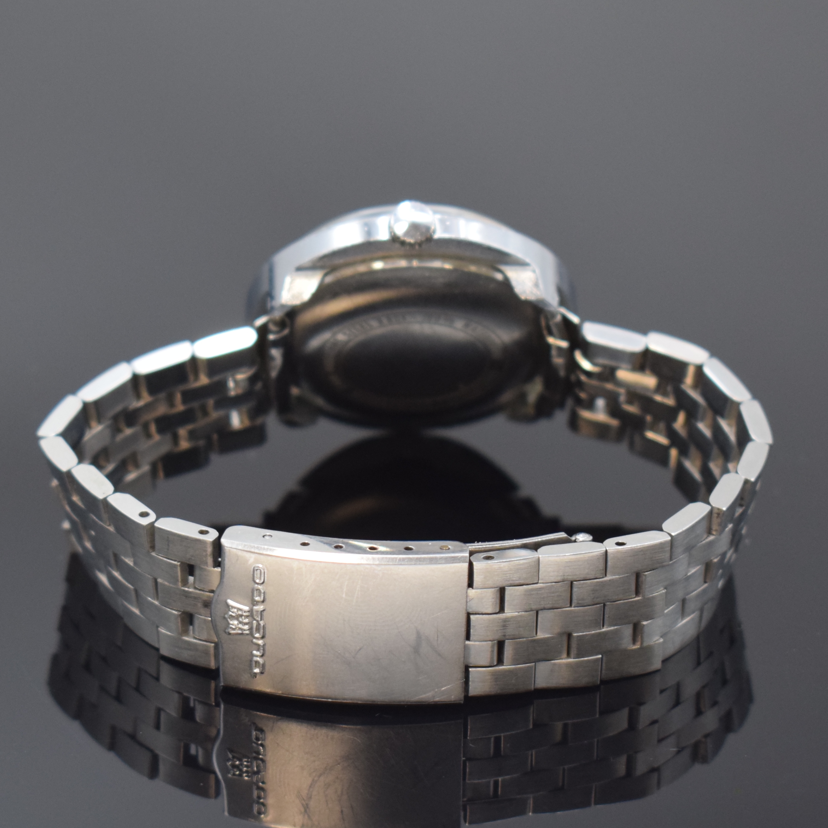 Detail b: DUCADO verchromte Herrenarmbanduhr, Schweiz um 1975, Automatik, orig. Gliederband m. Faltschl., Stahlboden aufgedr., schwarzes Zifferbl. m. ...