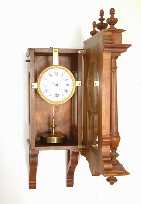 26782067b - Pendulum 400 Jours, wall clock, Claude Grivolas watch manufacturer, Paris, around 1910/20, so-called annual clock, decorated waxed walnut case (door cracked), model: Appique Style Henry II. (sales catalog 1910), glazed on three sides, signed enamel dial, round brass plate movement, Extensively signed/inscribed on the back plate, massive Graham gang, longer pendulum spring, torsion pendulum model Courant, height approx. 50cm, condition of movement 3, housing 2-3, rare model from the manufacturer