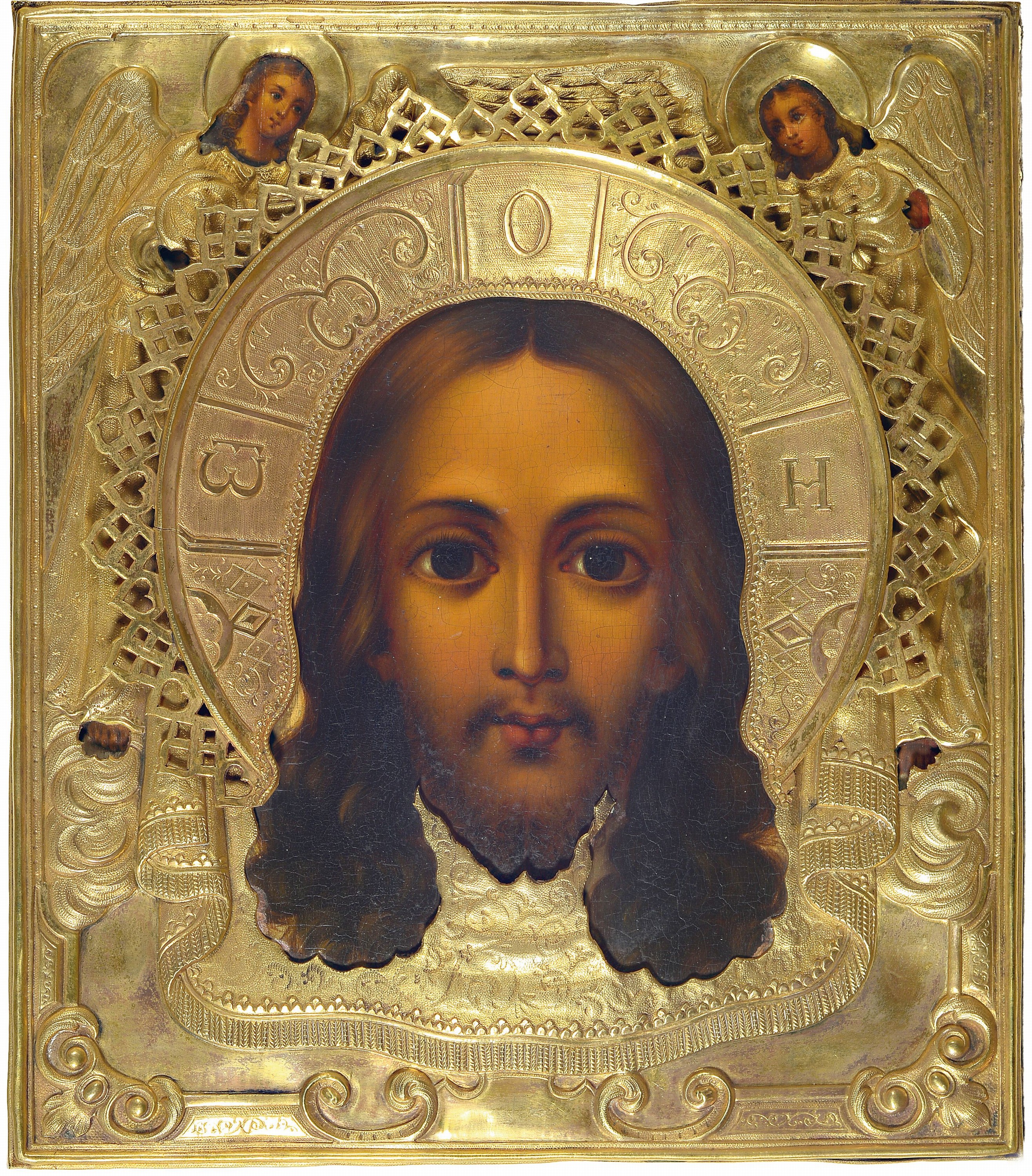 Ikone, Russland, 2. Hälfte 19. Jh., Mandorla Christus, Tempera auf Holz, reich verziertes Messingoklad, in den oberen Ecken Engel, ca. 35x31cm
